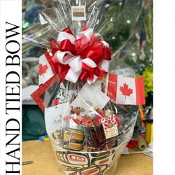 Hand-Tied vs. Pull Bows: Why Presentation Matters in our Gift Baskets