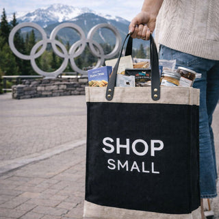 Black tote bag with 'Shop small' text Easter bunny ornament on a table | Vancouver Gift Baskets Best Sellers