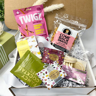 Gift box of gourmet items Easter bunny ornament on a table | Vancouver Gift Baskets under $75