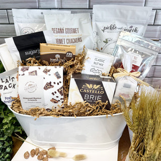 Large gift basket of assorted food items Easter bunny ornament on a table | Vancouver Gift Baskets for Gourmet Gifts