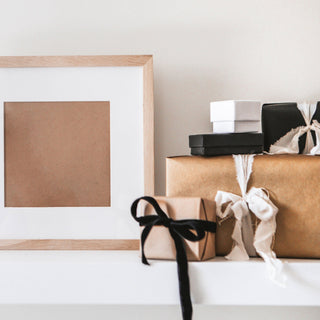 Gifts wrapped in brown paper and bows Easter bunny ornament on a table | Vancouver Gift Baskets Corporate Gift Ideas