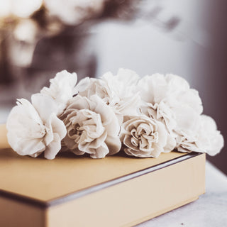 Neutral flowers on a gift box Easter bunny ornament on a table | Vancouver Gift Baskets for Her