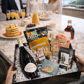 Gift box with wine and food items Easter bunny ornament on a table | Vancouver Gift Baskets between $150 - $200