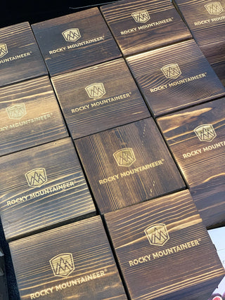 Stack of Rocky Mountaineer branded boxes